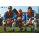 Football Martin Peters signed 12x8 colour photo pictured with his West Ham team mates Bobby Moore