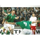 Johnny Evans Northern Ireland Signed 12 x 8 inch football photo. Good Condition. All autographs come