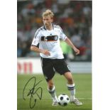 Simon Rolfes signed 12x8 colour photo pictured in action for Germany. Good Condition. All autographs