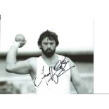 Athletics Geoff Capes 10x8 Signed B/W Photo Pictured In Shot Putt Action. Good Condition. All