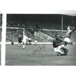 Alex Young signed 12x8 black and white photo pictured in action for Everton. Good Condition. All