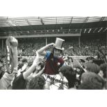Trevor Brooking West Ham Signed 12 x 8 inch colour enhanced football photo. Good Condition. All