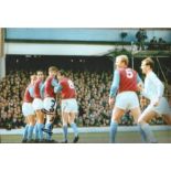 Martin Peters signed 12x8 colour photo pictured playing for West Ham United. Good Condition. All