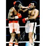 Boxing Larry Holmes signed 16x12 colour photo pictured in his World Heavyweight title fight with