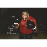 Boxing Tim Witherspoon signed colour photo. Tim Witherspoon (born December 27, 1957) is an