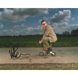 Vic Reeves Comedian signed 10 x 8 colour photo riding tiny bike. All autographs come with a