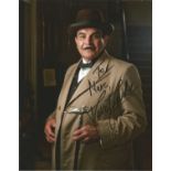 David Suchet as Poirot signed 10 x 8 colour photo to Marc. Full length pose in overcoat with walking