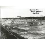 Flt Lt. Dick Starkey signed 12x8 black and white photo of the Stalag Luft II compound. All