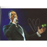 Russell Watson signed 12x8 colour photo of the singer performing on stage. All autographs come