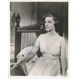 Lauren Bacall signed 10 x 8 inch vintage photo in low cut dress. Condition 8/10. All autographs come