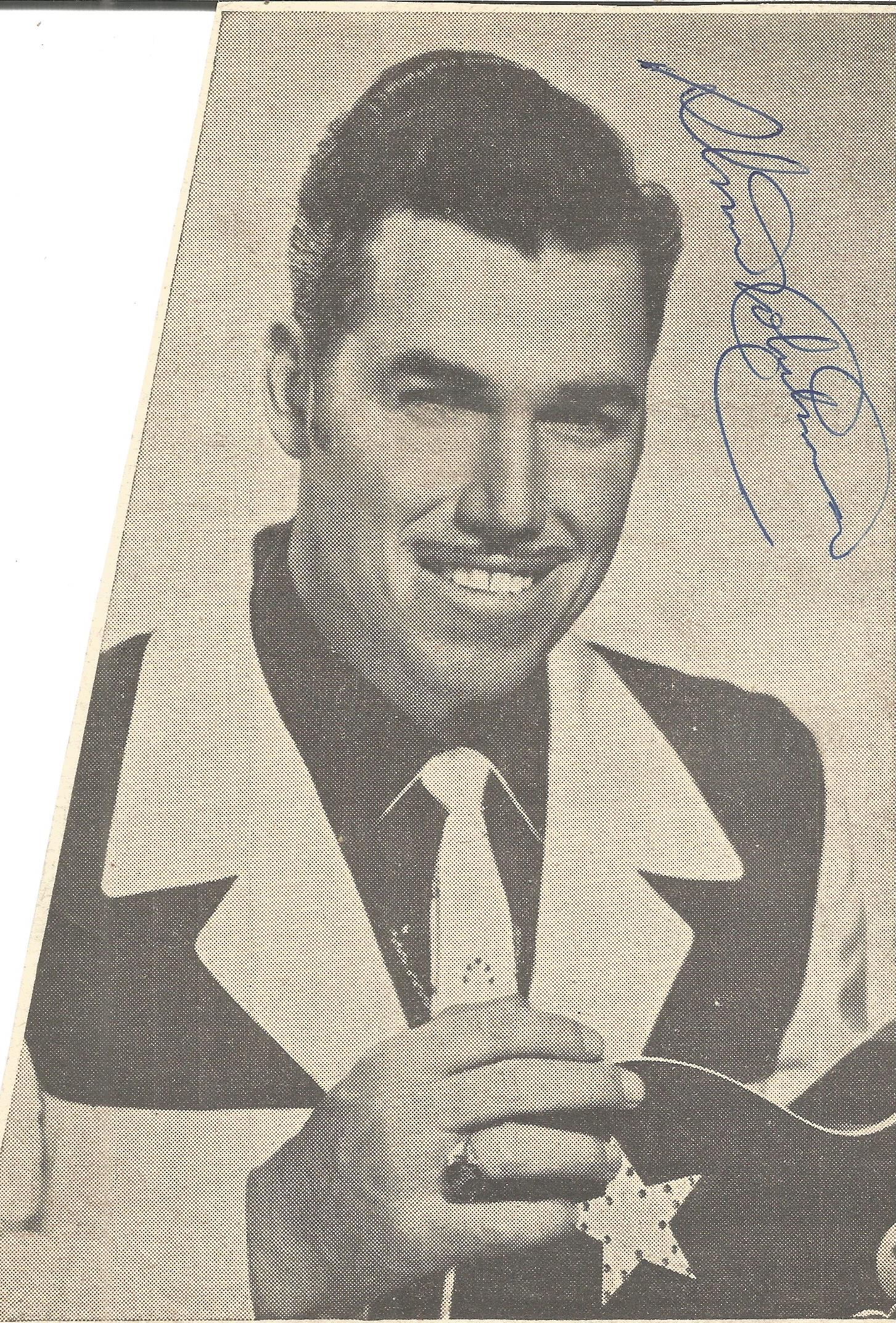 Slim Whitman signed 7 x 4 b/w magazine photo Condition 7/10. All autographs come with a