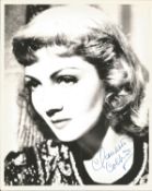 Claudette Colbert signed 10 x 8 inch b/w portrait photo. Condition 8/10. All autographs come with