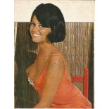 Claudia Cardinale signed A4 magazine page, signs of age Condition 6/10. All autographs come with a