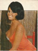 Claudia Cardinale signed A4 magazine page, signs of age Condition 6/10. All autographs come with a