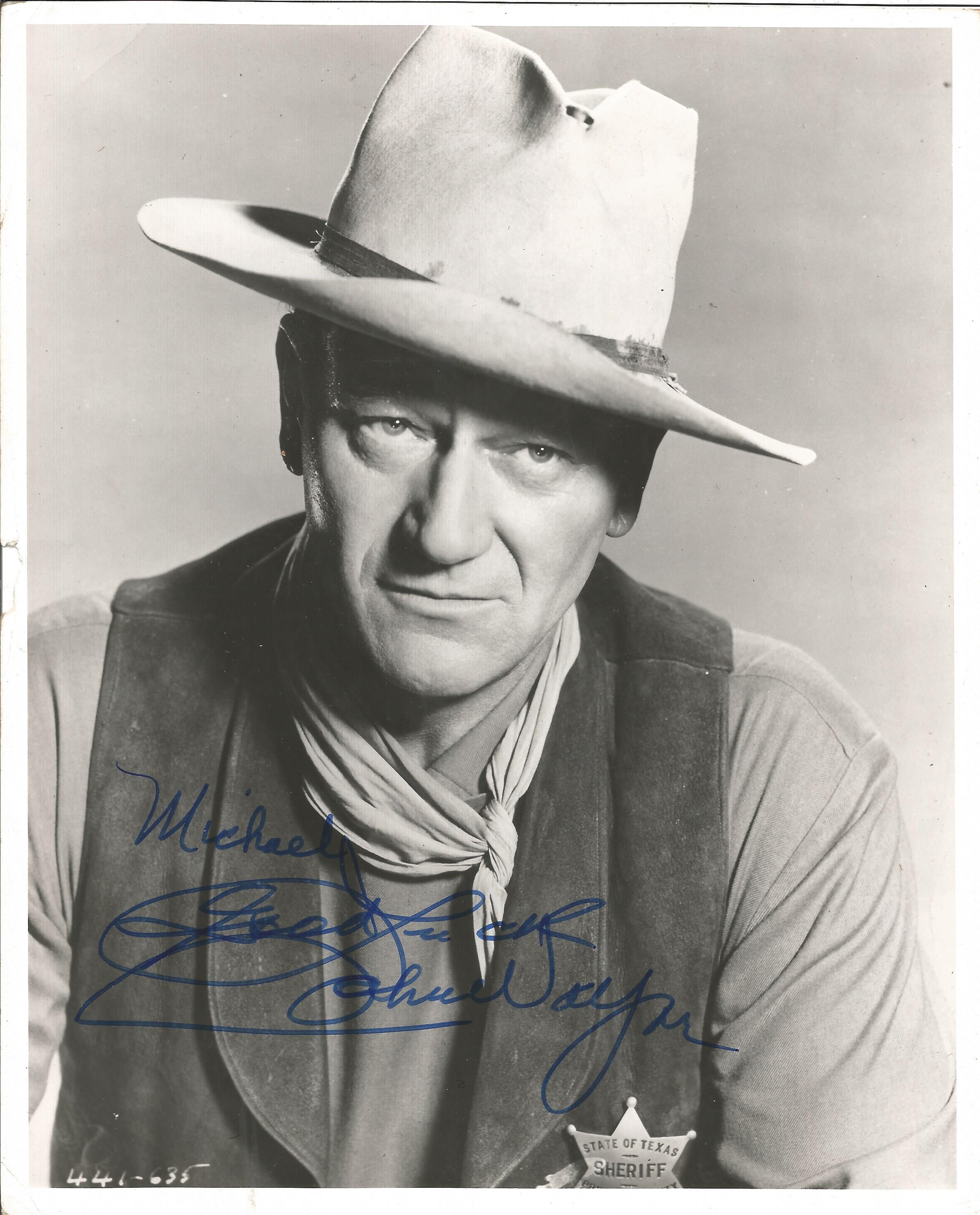 John Wayne signed 10 x 8 inch b/w photo to Michael. Image as Sheriff with State of Texas badge.