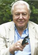 Sir David Attenborough signed 12 x 8 inch colour photo with butterfly on his finger. Condition 8/10.
