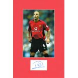 Rio Ferdinand signed card mounted below colour Man Utd display. Approx overall size 16x10. All