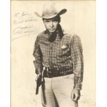 Audy Murphy signed 14 x 11 b/w vintage photo in western costume, dedicated. Has faults signs of