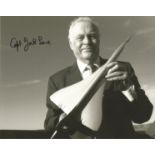 Cptn Jock Lowe signed 10x8 black and white photo of the pilot with model of Concorde. All autographs