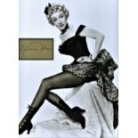 Marlene Dietrich signature piece, professionally mounted within vintage photo. Approx overall size