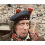 Doctor Who 8x10 photo signed by actor Tom Baker who was the 4th Doctor Who. All autographs come with