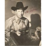 Wild Bill Elliott signed 14 x 11 b/w vintage photo in western costume, dedicated. Has faults signs