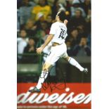 Landon Donovan USA Signed 10 x 8 inch football photo. All autographs come with a Certificate of