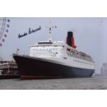 Cunard QE2. 8x12 inch photo signed by the captain of the QE2, Commodore R. W Warwick. All