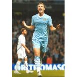 Football Edin Dzeko 10x8 signed colour photo pictured celebrating while playing for Manchester City.