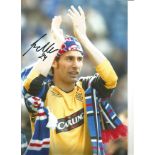 Carlos Cuellar Rangers Signed 10 x 8 inch football photo. All autographs come with a Certificate