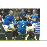 Maurice Edu Celtic goal Rangers Signed 10 x 8 inch football photo. All autographs come with a