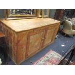 A 19th century pitch pine cupboard