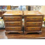 A pair of miniature reproduction chests of drawers