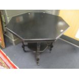 A black painted aesthetic movement octagonal occasional table, 84cm diameter
