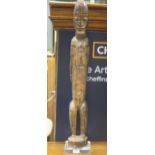 Modern wood carved African figure of a standing warrior (Dimensions: 96cm high)(96cm high)