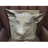 A modern resin in relief of a pig's head, 40 x 33cm