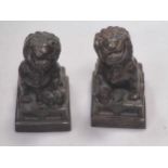 A pair of Chinese bronze lions, 12cm high