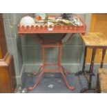 A wrought iron garden planter table with stiff leaf galleried top painted in red oxide, 89 x 70 x