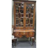 A George III oak lowboy together with an associated glazed display cabinet top, 177cm high