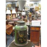 A 19th century painted tin tea cannister the central scene with Oriental figures converted to a