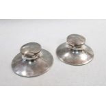 A pair of Edward VII silver capstan inkwells,