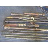 Four early 20th century African fishing spears and various other knives and clubs etc