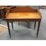 A Regency mahogany galleried back wash stand in the manner of Gillows, on reeded column legs and