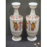 A pair of 19th century opaque white glass vases, with polychrome decoration of figures, leaves and