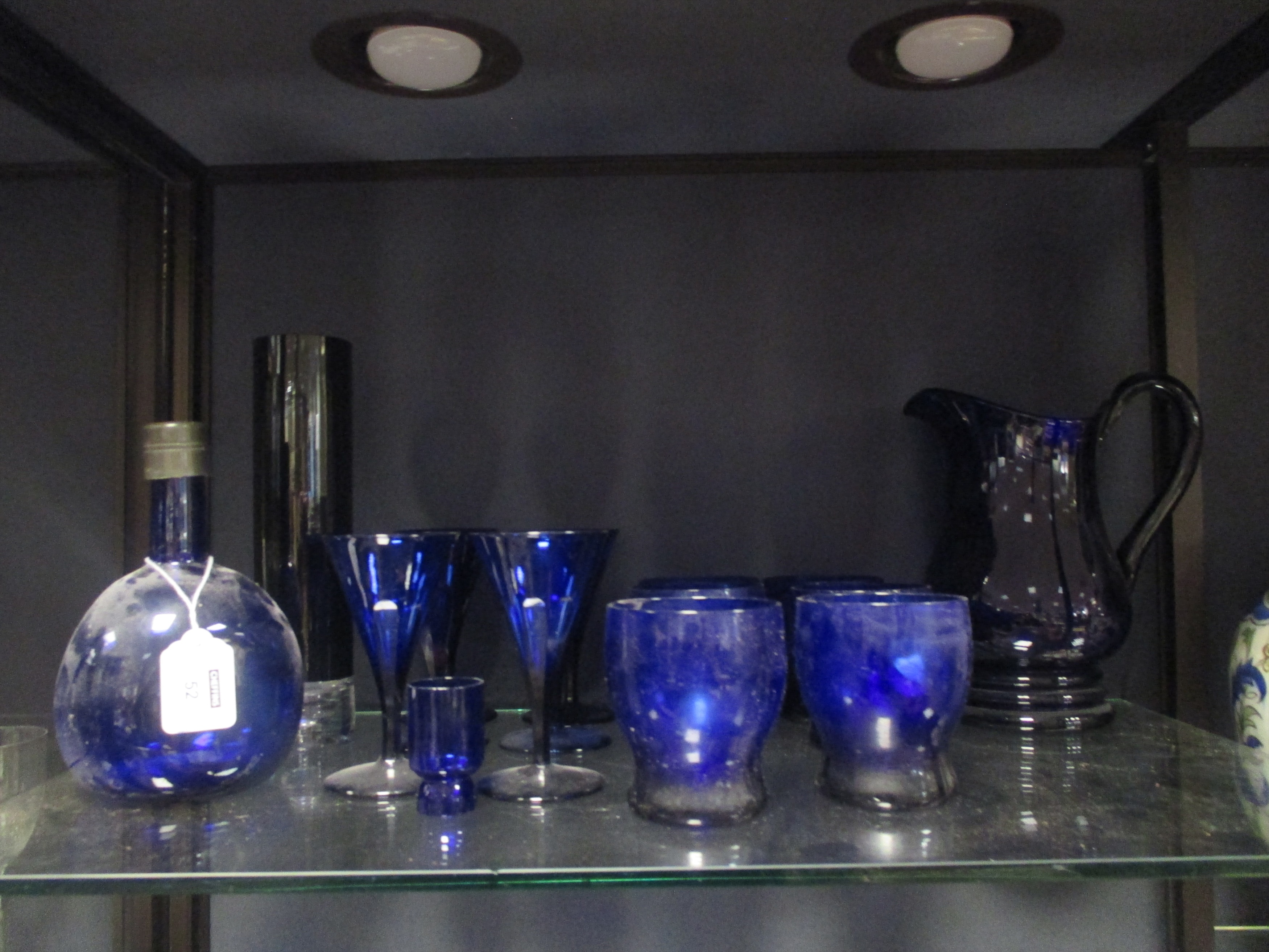 A Victorian 'Bristol blue' water jug and six matching glasses and six wine glasses and other blue