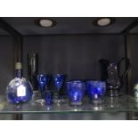 A Victorian 'Bristol blue' water jug and six matching glasses and six wine glasses and other blue