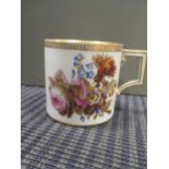 A Meissen coffee cup with painted flowers and gilt decoration, crossed swords marked base