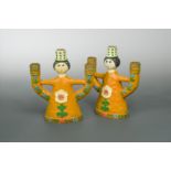 In the manner of Bjorn Winblad, a pair of mid 20th century figural candlesticks,