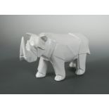 In the manner of Akira Yoshizawa, a white glazed model of a rhino,