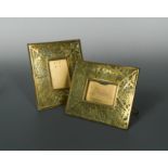 Two Tiffany Studios pierced brass and slag glass photograph frames,